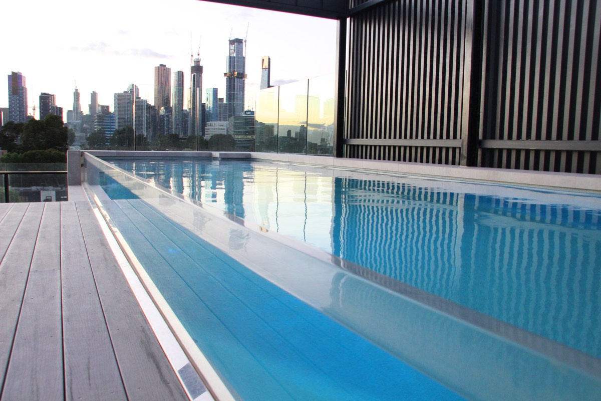 8m custom Fastlane in colour Quartz with acrylic panel. Pool installed by Compass Pools Melbourne