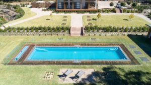 Compass Pools Australia Pool with Pool Cover and Pool Roller in Contemporary 16.6m CUSTOM Evolution